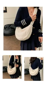 Detail of soft white plush dumpling bag showing cozy fleece texture and crescent shape