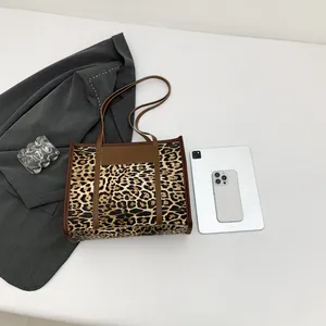 Vintage leopard print tote bag with brown leather trim for autumn winter fashion