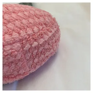 Close-up of soft pink fleece texture and fluffy material for women's shoulder bag
