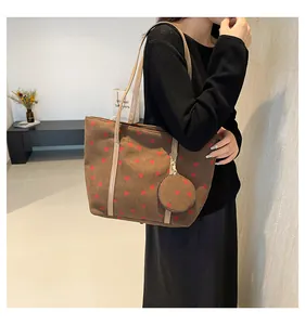 Brown corduroy tote bag with red strawberry patterns and matching mini round pouch