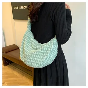 Detail of light green plush hobo bag with soft textured fabric and large capacity
