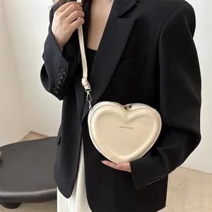 Minimalist heart-shaped cream shoulder bag with FASHION & BAG print and long strap