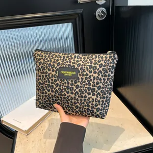 Portable leopard print makeup bag with zipper closure and fashion leather label