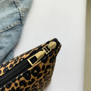 Canvas makeup bag with classic leopard print and premium gold metal zipper detail