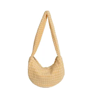 Creamy yellow pleated popcorn fleece hobo bag with soft plush texture for autumn winter