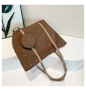 Detail of strawberry print corduroy tote bag set with matching small round coin purse