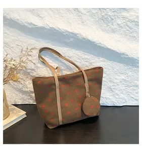 Brown corduroy tote bag with strawberry print and small matching round coin purse detail