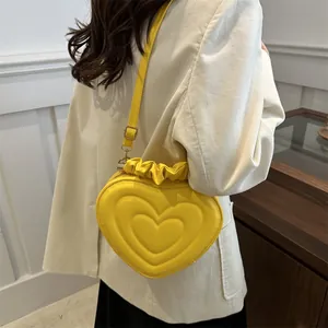 Sac à main tendance jaune en forme de cœur en cuir PU avec fermeture plissée élégante