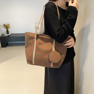 Brown corduroy tote bag with strawberry pattern and matching mini coin purse charm