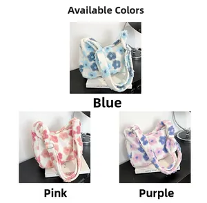 Close-up of fluffy floral tote bags in blue, pink, and purple soft plush material