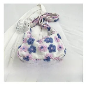 Floral plush tote bag detail with smartphone for size scale and texture view