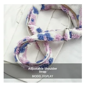 Detail of adjustable plush shoulder strap with purple dots and silver metal buckle