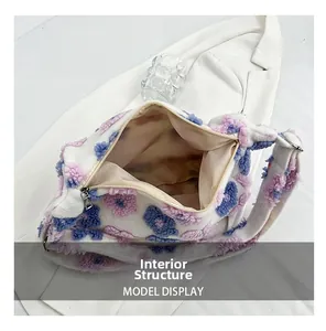 Detail view of the floral plush tote bag interior with beige lining and metal zipper