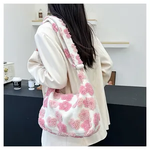 Detailed side view of floral plush tote bag with pink flowers on white faux fur strap