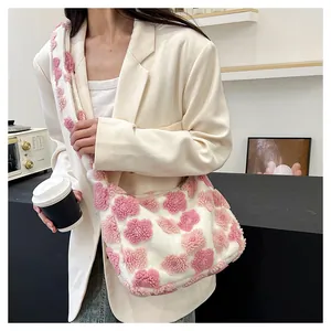 Close-up of plush floral tote bag with white faux fur and 3D pink flower details
