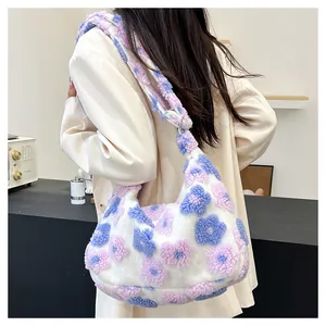 Detail of floral plush crescent bag with pink and purple 3D flower patterns on white faux fur