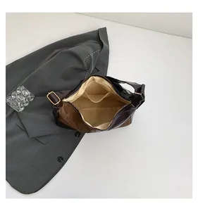 Detail view of the contrast color tote bag showing the fabric lining and dual inner pockets
