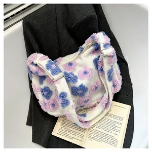 Detailed view of floral plush tote bag with 3D flower pattern and metal buckle