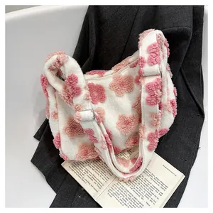 Detail of plush floral tote bag with soft faux fur texture and adjustable strap buckles