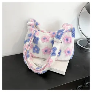 Detail of soft plush tote bag featuring colorful 3D floral textures and fuzzy strap
