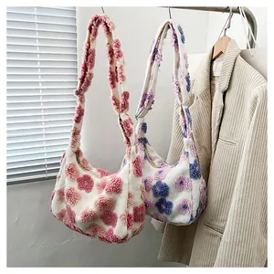 Detail of plush floral tote bags with soft 3D flower accents and wide fuzzy straps
