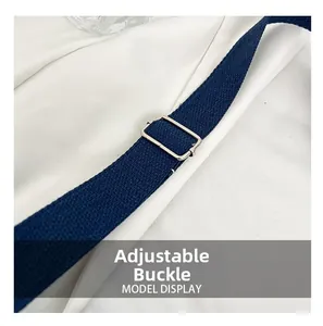 Close-up of adjustable silver metal buckle on a navy blue canvas crossbody strap
