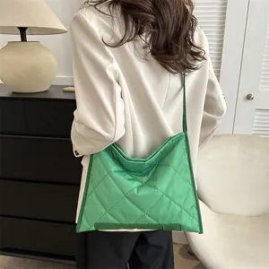 Bright green quilted nylon crossbody bag featuring large rhombic patterns for casual wear