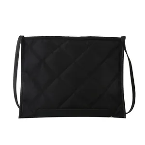 Chic black quilted diamond pattern shoulder bag with sleek nylon finish and slim strap