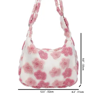 White plush tote bag with pink 3D flower details and adjustable metal buckle strap