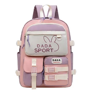 Detailed front view of color-block school backpack with embroidery and multi-pocket design
