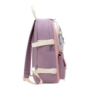 Side view of purple and pink school backpack with side pockets and multi-layer zippers