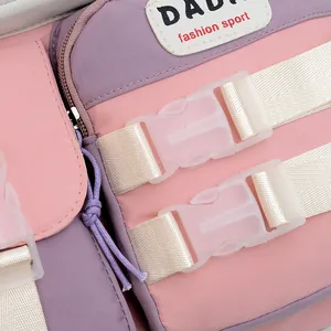 Detail of a pink and purple color-block backpack with buckle and durable canvas texture
