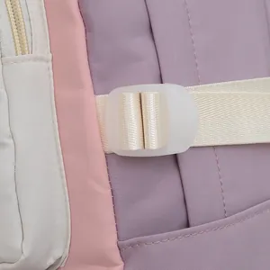 Detail of color-block nylon fabric with plastic buckle and woven strap for backpack