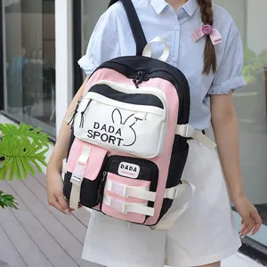 Detail of tricolor pink and black school backpack with DADA SPORT print and buckles