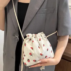 Cute strawberry print corduroy bucket bag with drawstring strap for daily casual styling