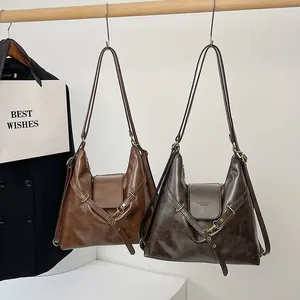 Bolsos hobo vintage grandes en cuero marrón y gris con hebillas metálicas de bronce