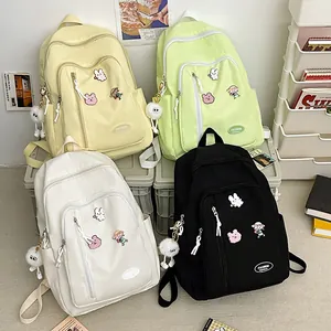 Sac à Dos en Nylon de Grande Capacité pour Femmes Style Japonais Sac d'École pour Étudiants Sac de Voyage Imperméable avec Épingles Cartoon et Pendentif en Peluche
