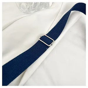 Detail of durable navy canvas strap with polished silver metal adjustment buckle