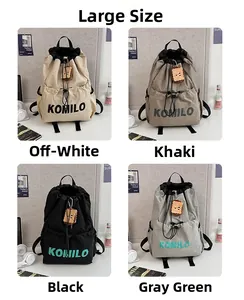 Detail of four color options for large drawstring backpacks with side pockets and plush charm