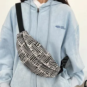 Ethnic canvas chest bag with black and white geometric stripes and adjustable strap