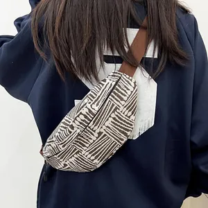 Ethnic style canvas crossbody chest bag with brown geometric stripes and wide strap