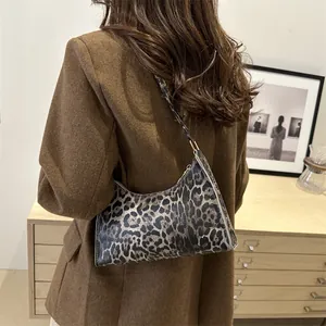 Minimalist leopard print baguette shoulder bag for women with golden hardware details