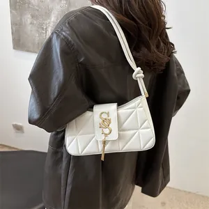 White quilted underarm shoulder bag with gold SSS buckle and tassel for women