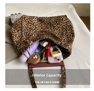 Top view of leopard print tote bag interior showing large capacity and daily essentials