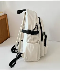Side view of beige college backpack featuring durable straps and practical side pocket