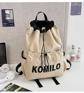 Close-up of lightweight nylon drawstring backpack with adjustable straps and front pocket