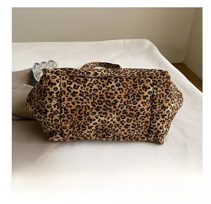 Detail view of the durable wear-resistant bottom on this leopard print canvas tote bag