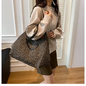Close-up of leopard print canvas tote bag showing thick texture and spacious design