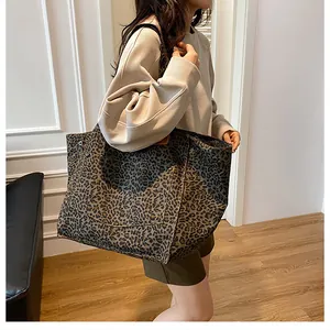 Close-up of leopard print tote bag featuring high-quality leather texture and large capacity
