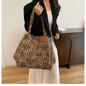 Detail of leopard print canvas tote bag featuring premium texture and large capacity